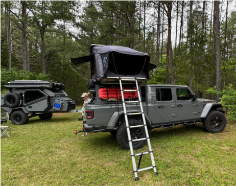 tent on top of car setup with ladder